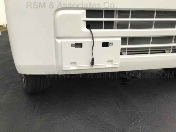 A close up of the front bumper and door.