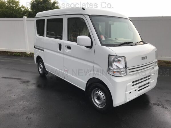 A white van is parked in the parking lot.