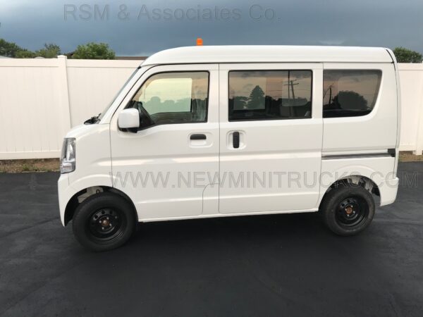 A white van is parked in the parking lot.