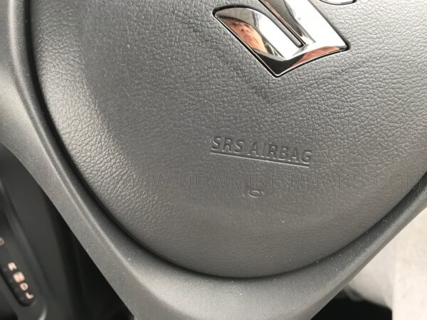 A close up of the steering wheel on a car