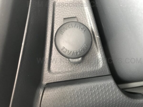 A close up of the button on a car