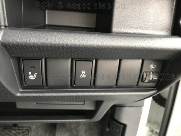 A close up of the buttons on an automobile.