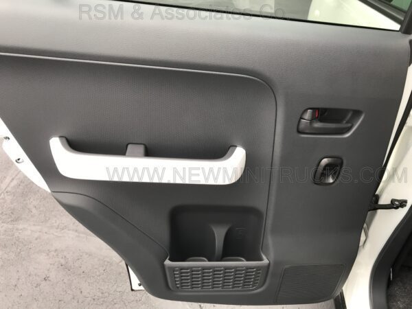 A car door handle with the seat in the back.