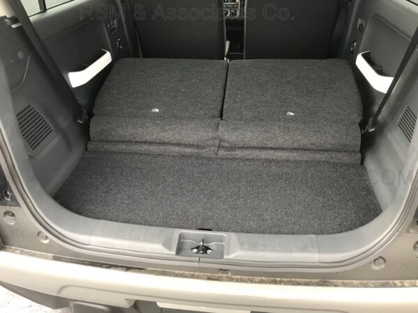 A car trunk with two seats folded down.