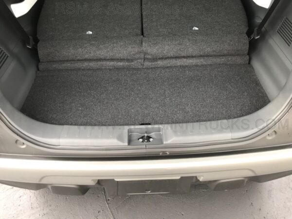 A car trunk with the back seat folded down.