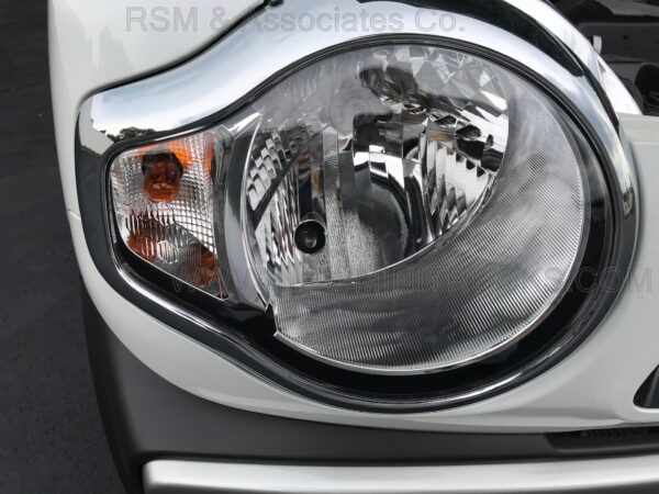 A close up of the headlight on a car.