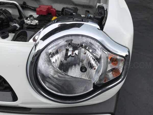 A close up of the headlight on a car