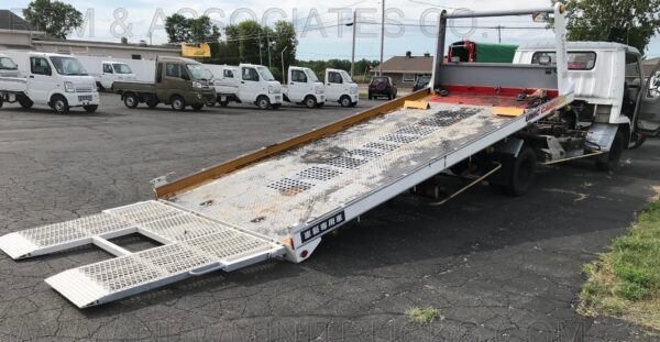 A truck with a ramp on the back of it