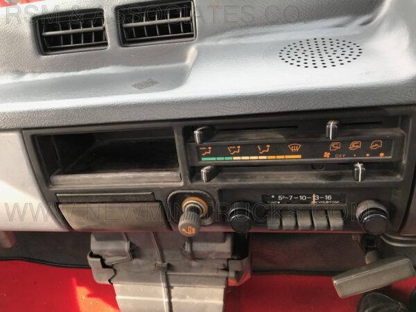 A car radio with buttons and knobs on the front.