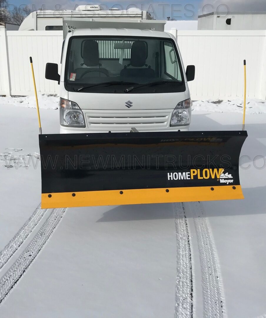 a mini truck with a plow