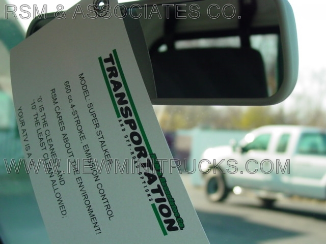a piece of paper hanging on a car’s rearview mirror
