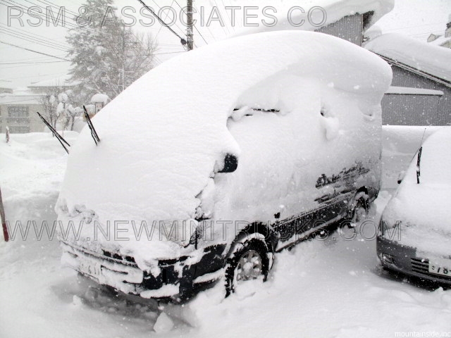 a vehicle covered in snow