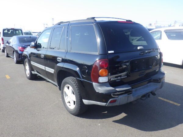 A black suv parked in the parking lot.