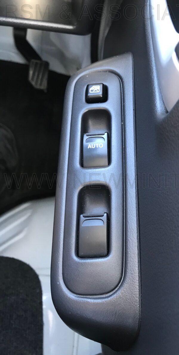 A car 's dashboard with the buttons on it.