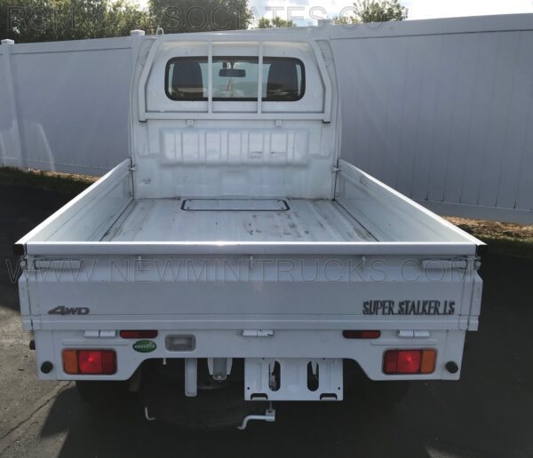 A white truck parked in the parking lot.