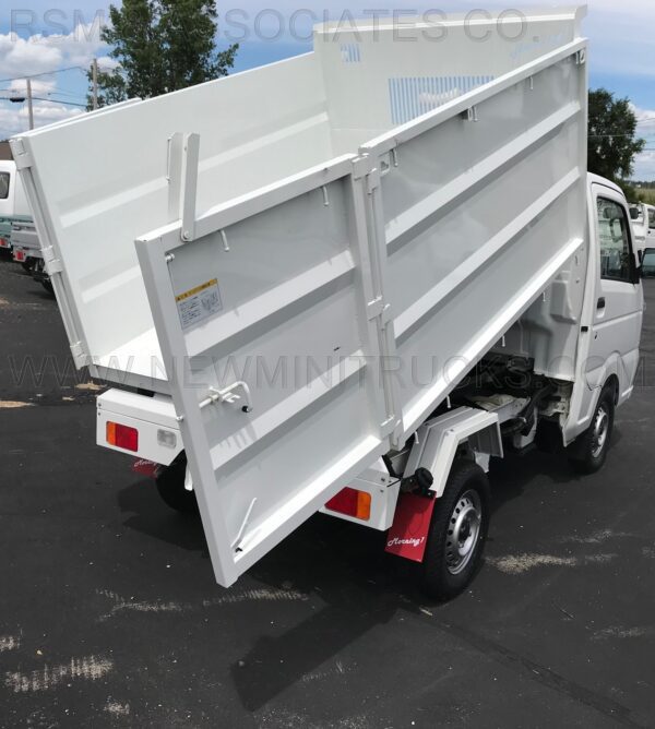 A white truck is parked in the parking lot.